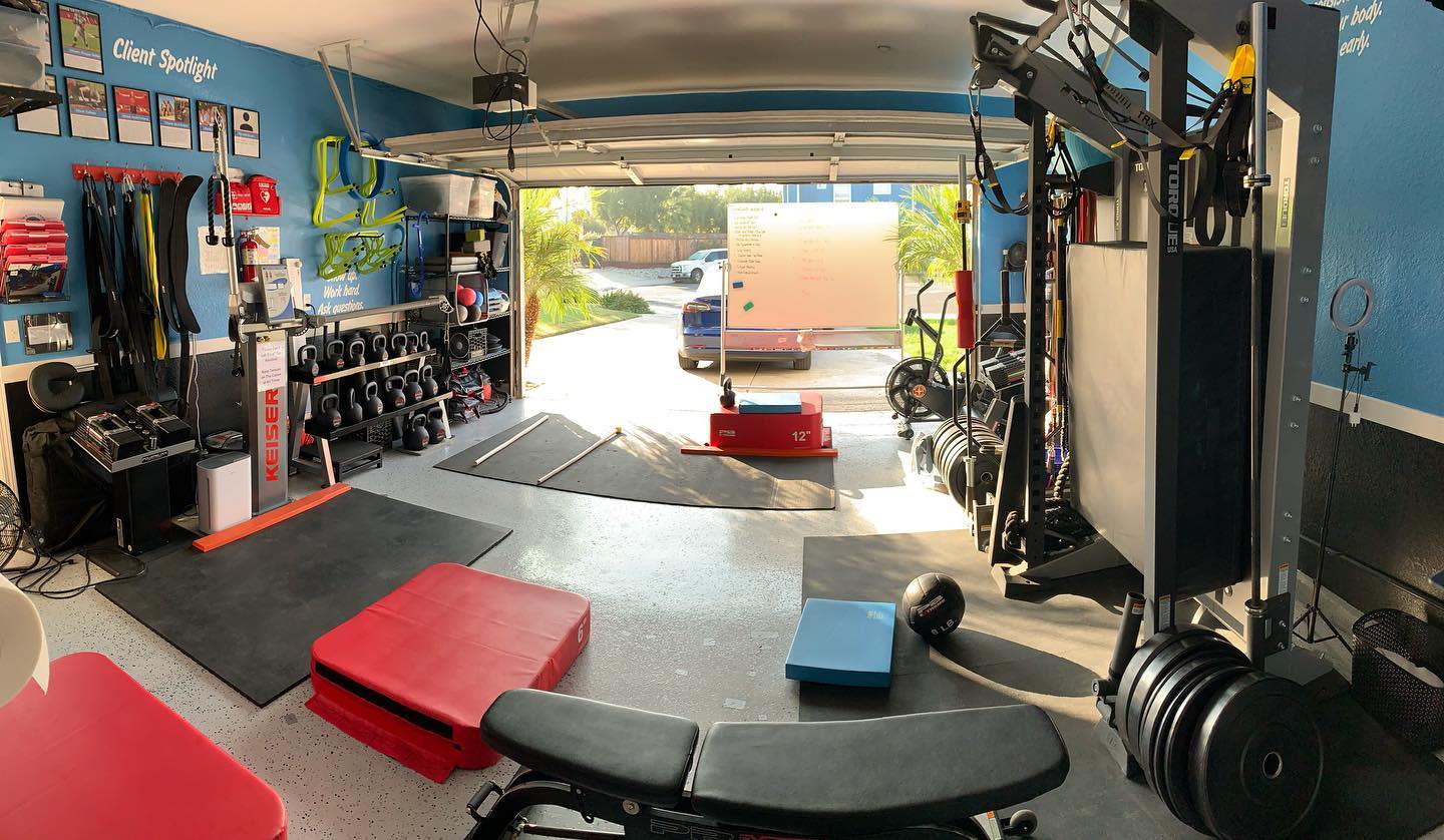 large garage gym benchpress dumbbells free wights